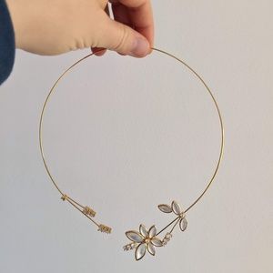 Gold choker necklace with flower design and rhinestones